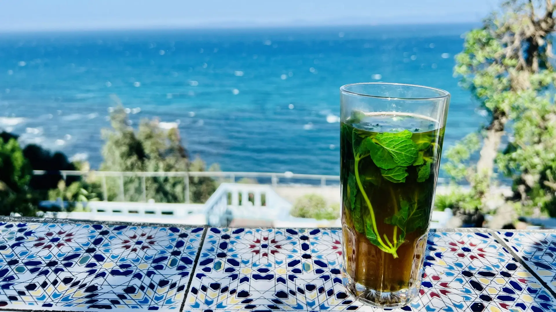 Mint tea on terrace at Café Hafa overlooking Strait of Gibraltar Mint tea on terrace at Café Hafa overlooking Strait of Gibraltar