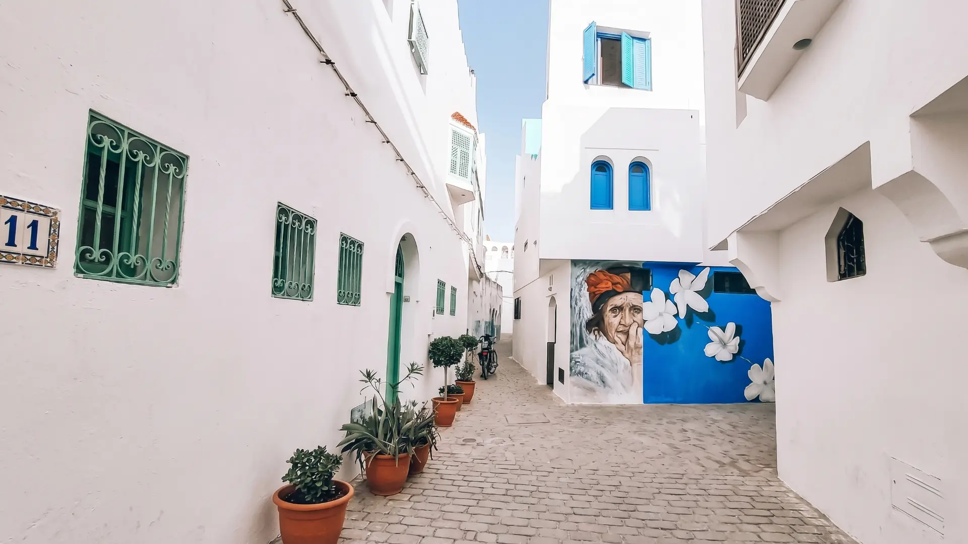 Artistic Mural in Asilah Old Town Creative graffiti and mural artwork in the medina of Asilah