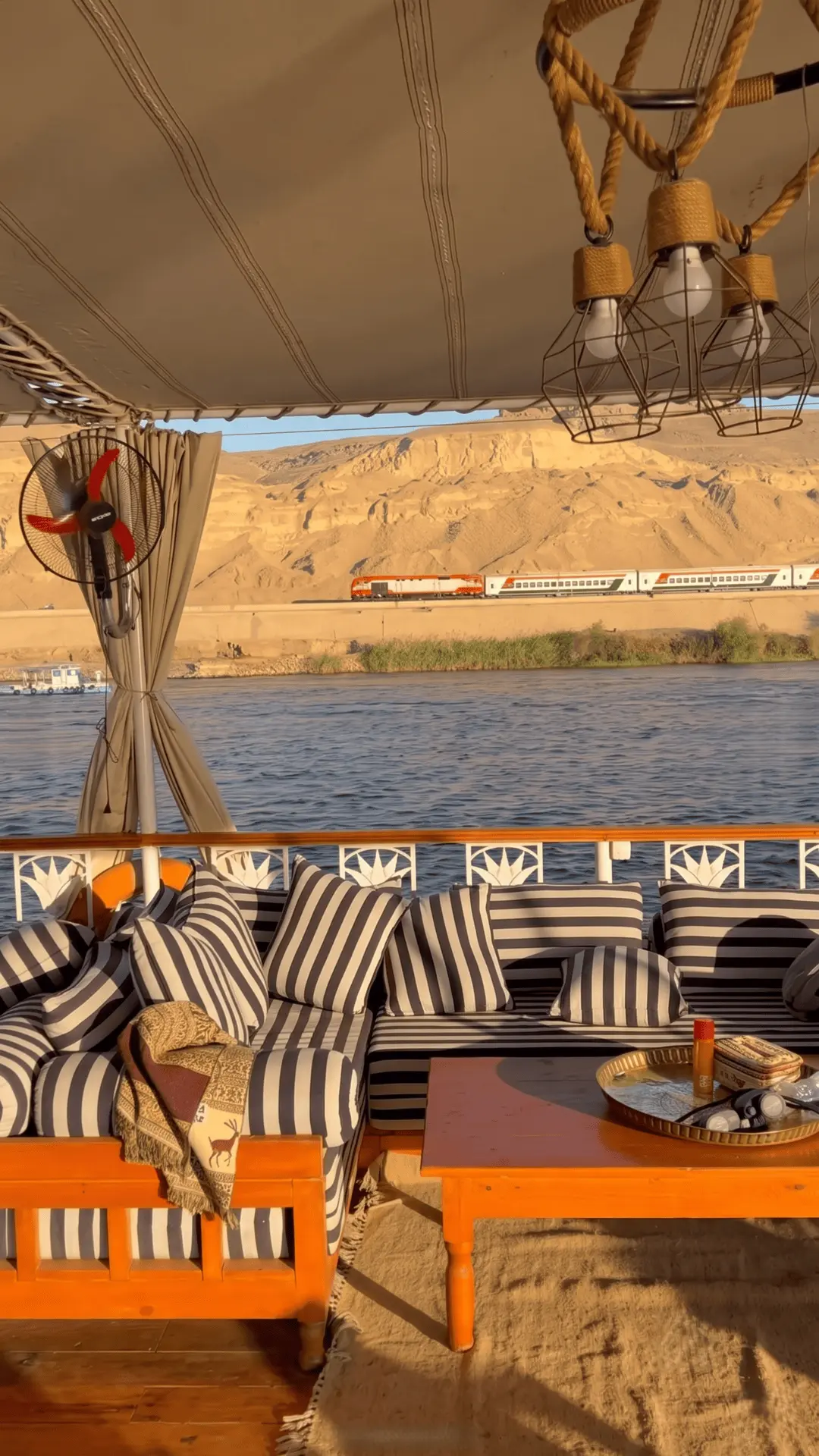 Train View from Dahabiya Deck | Unique Nile Cruise Moment Egypt Interesting view of a passing train seen from the deck of a dahabiya on the Nile River
