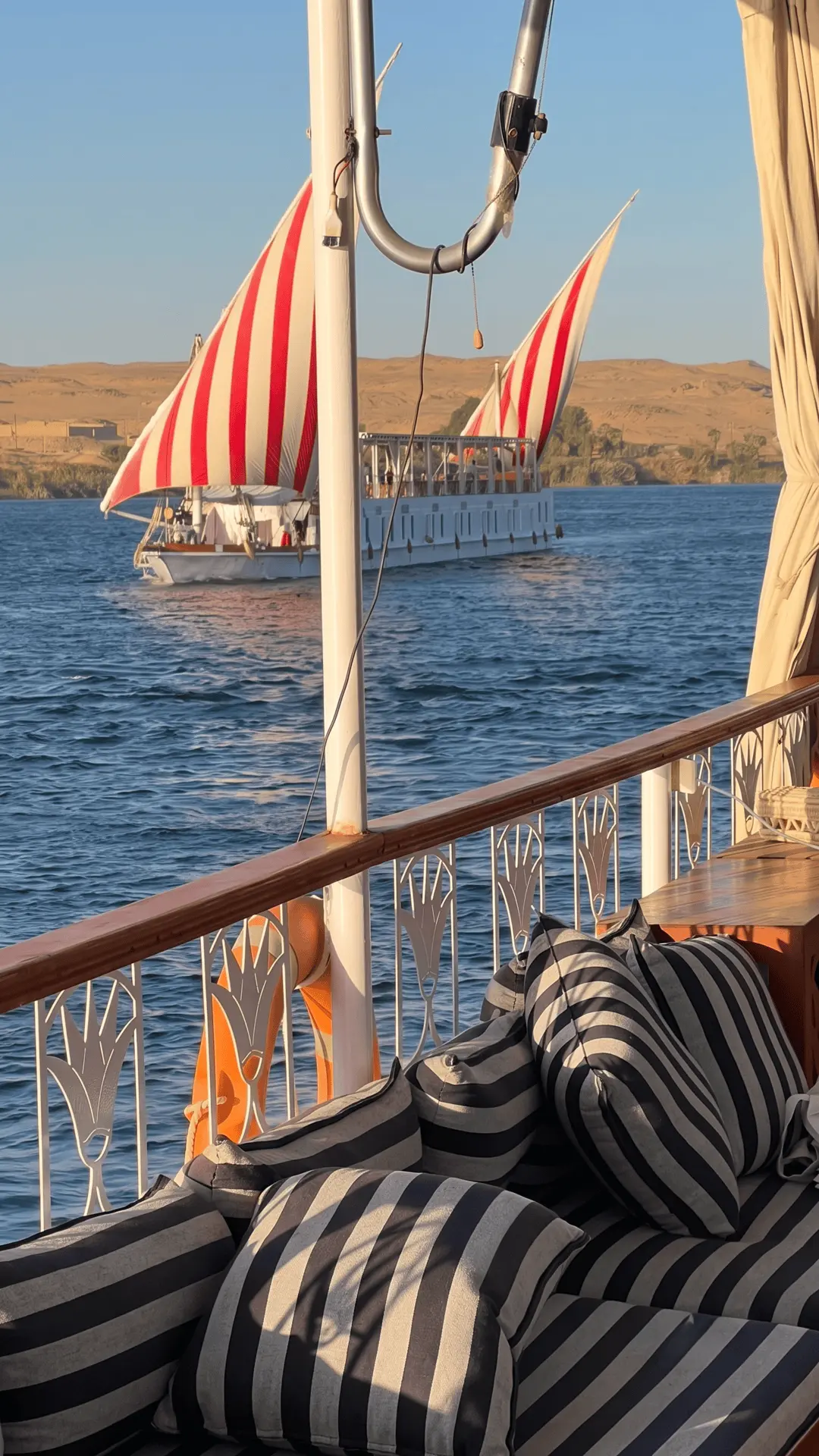 Dahabiya Nile Cruise Egypt | Luxury Traditional River Journey Elegant dahabiya sailing on the Nile River during a classic cruise in Egypt