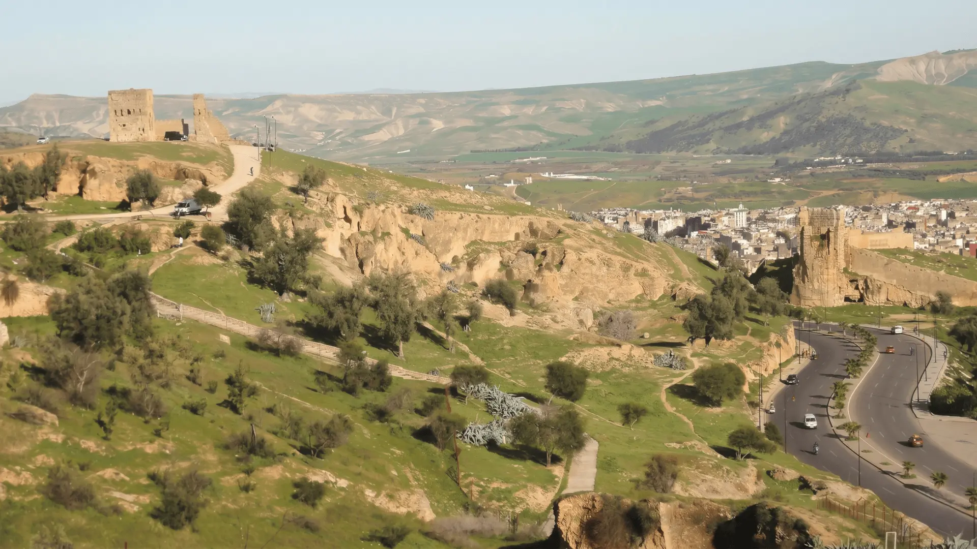 Marinid Tombs Fez Morocco | Panoramic Entrance View to the Medina Wide landscape view from Marinid Tombs overlooking Fez Medina with ancient ruins, hills, and cityscape — iconic entrance panorama to Fez Morocco