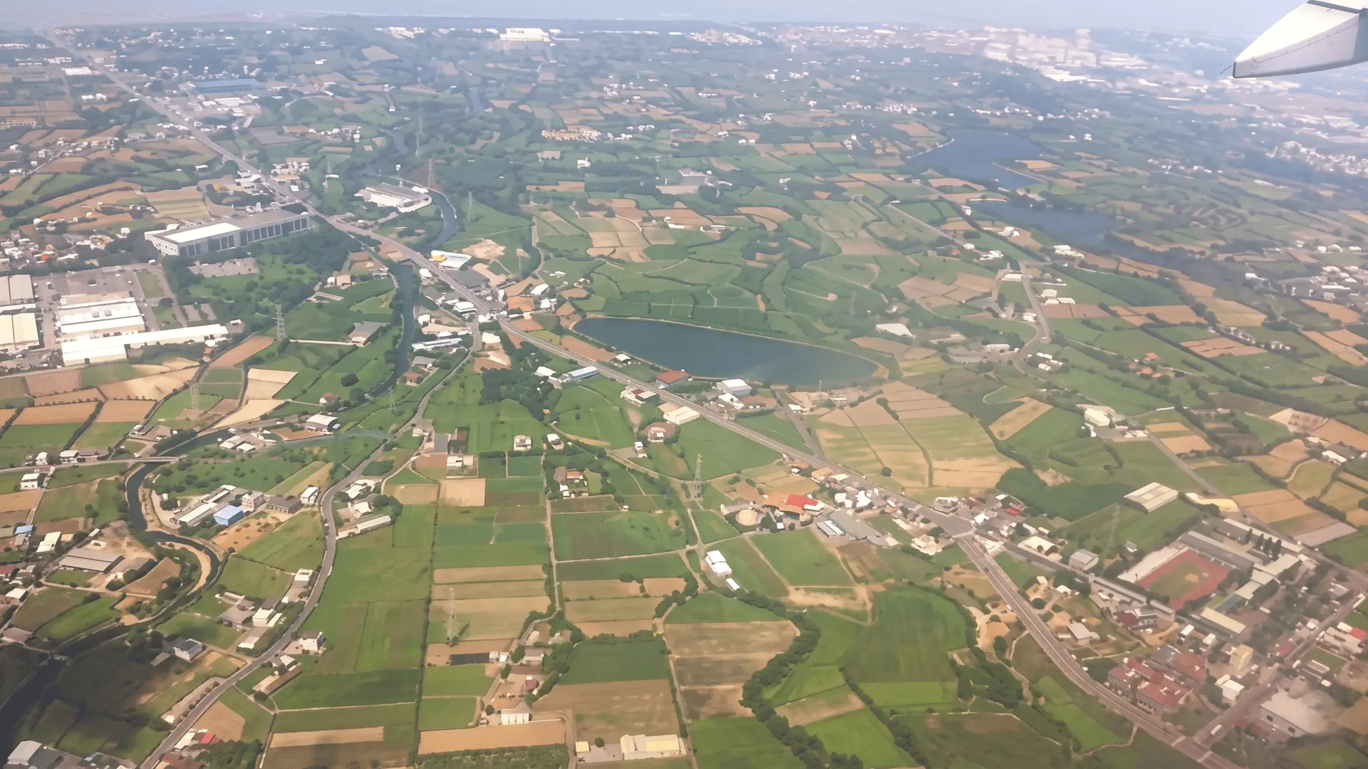 Aerial View of Taipei City from Airplane | Taiwan Skyline Beautiful aerial view of Taipei cityscape with Taipei 101 visible during airplane landing or takeoff